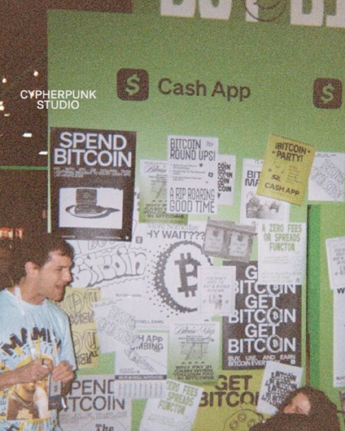 The SPEND BITCOIN wall, mid-party